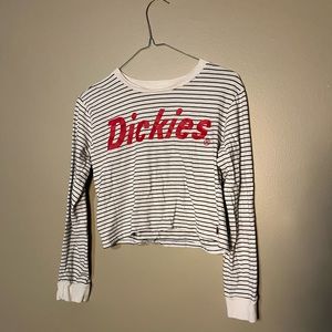 Black and white stripes with red letters. Long sleeve.